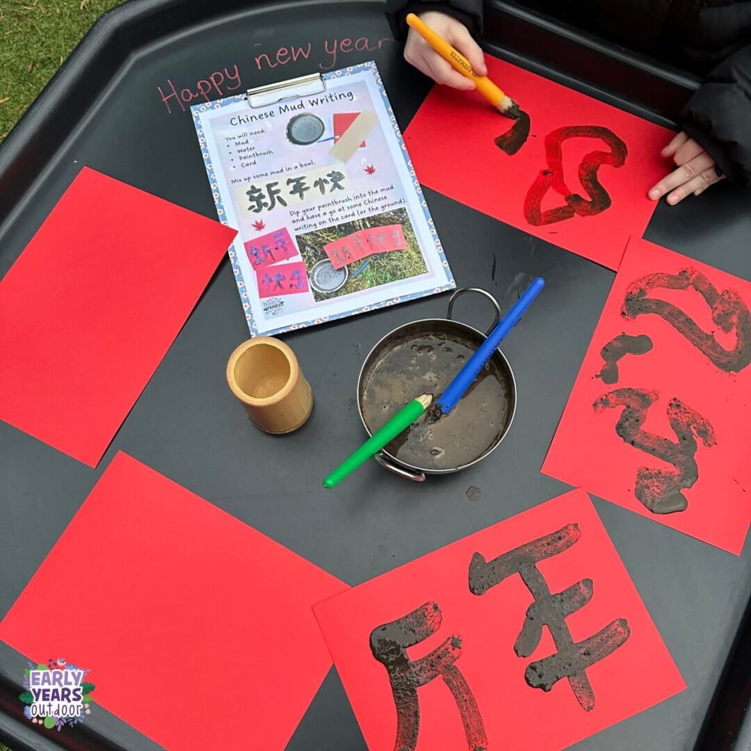 Lunar New Year mud painting Lunar new year mud painting, with red paper, bowls of mud and paintbrushes