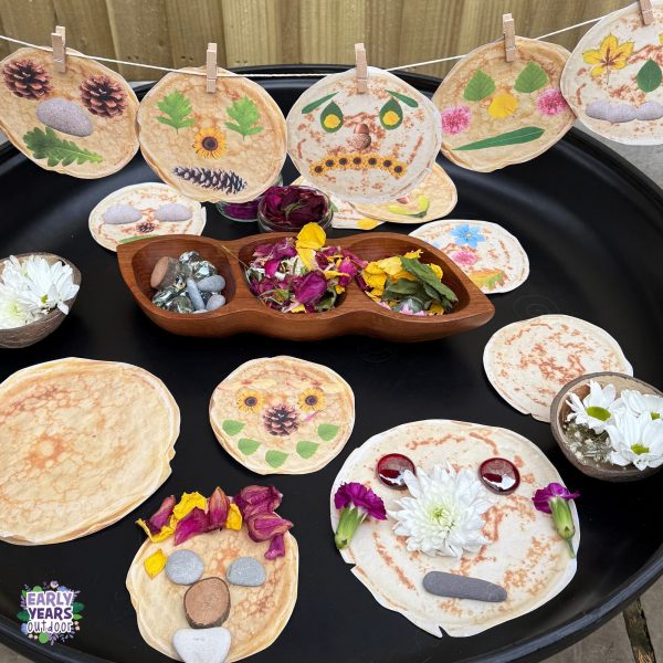 Nature pancake faces tuff tray with printed pancakes, bowls of nature, and pancake faces pegged on a string above