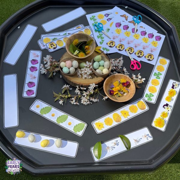 Spring patterns tuff tray set up with bowls of flowers, eggs and nature, scissors and the spring pattern sheets