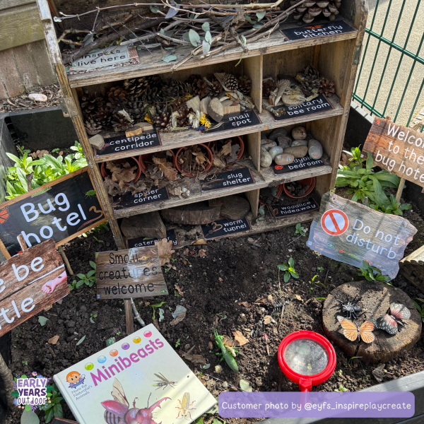 Bug hotel signs set up in a dolls house
