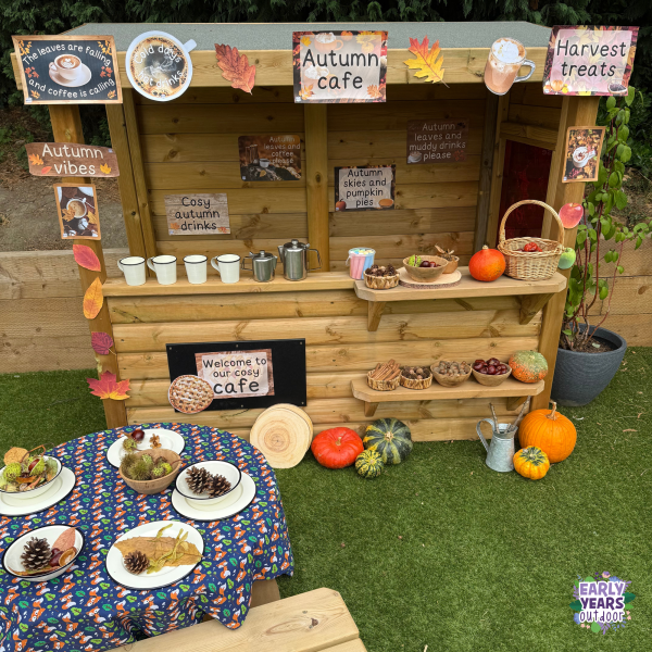 Autumn cafe role play with signs, pumpkins, autumn nature and a picnic set up